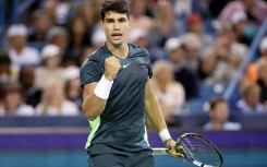 Carlos Alcaraz celebrates during his gruelling Cincinnati Open win over Australia's Jordan Thompson