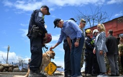 Biden met some of the search and rescue teams that are hunting for victims of the wildfire