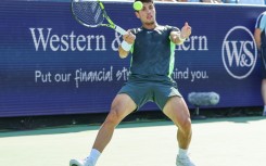 Carlos Alcaraz scrambles for a forehand in his loss to Novak Djokovic in the final of the ATP Cincinnati Open