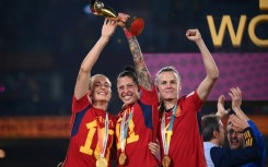 Jenni Hermoso (C) holds aloft the Women's World Cup after Spain's 1-0 victory in the final against England