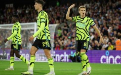 Arsenal's Martin Odegaard (R) celebrates scoring against Crystal Palace