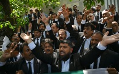 Lawyers and supporters of Pakistan's former prime minister Imran Khan outside the Islamabad High Court after the suspension of Khan's prison sentence for a graft conviction