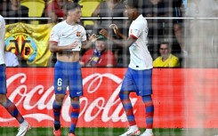 Barcelona winger Lamine Yamal (R) celebrates with team-mate and fellow academy graduate Gavi (L)