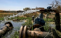 Water flows from irrigation pipes in the Palestinian village of al-Auja in the occupied West Bank