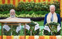 India's Prime Minister Narendra Modi and US President Joe Biden pay their respects at the Mahatma Gandhi memorial