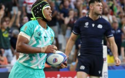 South Africa's wing Kurt-Lee Arendse (L) celebrates after scoring a try