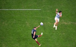 England's fly-half George Ford kicks a drop goal