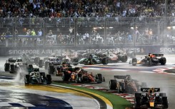 Red Bull's Sergio Perez leads in the rain at the start of the Singapore Grand Prix a year ago