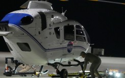 Crews prepare one of the helicopters that will participate in the Osiris-Rex asteroid sample return recovery mission in Dugway, Utah