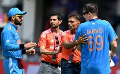 Security breach: Officials get between the pitch invader and India star Virat Kohli