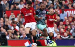 Manchester United defender Harry Maguire (L)