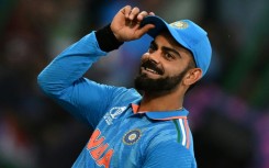 Fan favourite: India's Virat Kohli gestures to spectators during the win over Afghanistan 