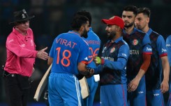 Respect: Afghanistan players greet India's Virat Kohli  at the end of the match 