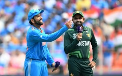 Centre of attention: India captain Rohit Sharma tosses the coin as Pakistan captain Babar Azam watches