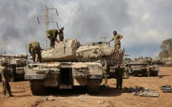 After a week of bombing in Gaza, Israel has built up a huge force on the territory's border ahead of an expected ground invasion