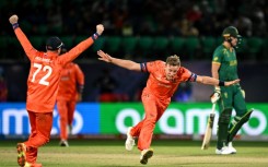 Key breakthrough: South Africa's Kagiso Rabada celebrates after taking the wicket of Bas de Leede 