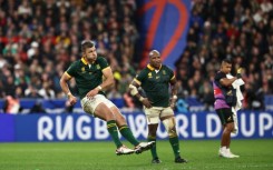 South Africa's fly-half Handre Pollard kicks the winning penalty for South Africa against England at the Stade de France