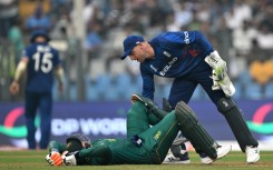 Cramping my style: England captain Jos Buttler helps South Africa century-maker Heinrich Klaasen who struggled with cramp