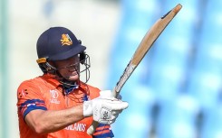 In the runs: Logan van Beek celebrates after scoring a half-century in the game against Sri Lanka in Lucknow 