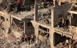 Gazans are struggling to reach people crushed under buildings hit by Israeli air strikes, with many using their bare hands to try and dig them out