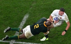 Bongi Mbonambi (L) may have been taught by his white school friends to play rugby but he also learned how to party with them too