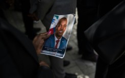 A picture of late Haitian President Jovenel Moise being held during a ceremony at the National Pantheon Museum in Port-au-Prince, Haiti