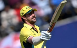 Head of the class: Australia's Travis Head celebrates after scoring his century on Saturday