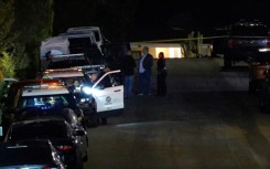 In this screen grab from an AFPTV video, police officers taped off the street leading to Matthew Perry's house in Los Angeles