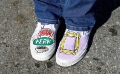 A fan wearing 'Friends'-themed shoes pays respects outside the Los Angeles house of actor Matthew Perry on October 29, 2023