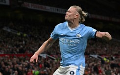 Erling Haaland celebrates his goal from the penalty spot against Manchester United