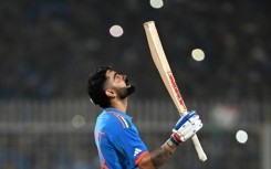 Moment of glory: Virat Kohli celebrates after scoring his 49th ODI century on Sunday 