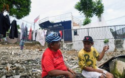 Rosie Boaquena, 63, moved to a new concrete house 13 kilometres from downtown Tacloban, but two of her sons chose to stay in a one-room shack by the sea to be closer to their jobs