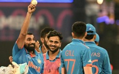 Five star: India's Mohammed Shami (L) celebrates after taking his fifth wicket against Sri Lanka