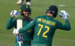 Century makers: South Africa's Quinton de Kock (left) celebrates with teammate Rassie van der Dussen 