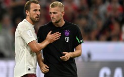 Bayern Munich forward Harry Kane (L) and defender Matthijs de Ligt. De Ligt will miss several weeks with a knee injury. 