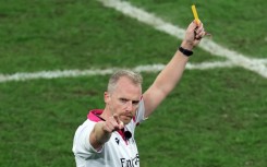 The final card: Wayne Barnes shows a yellow card to South Africa's Cheslin Kolbe in the closing minutes of the World Cup final