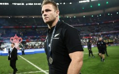 New Zealand captain Sam Cane walks on the field with his silver medal after South Africa won the Rugby World Cup final in Paris