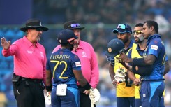 Out: Sri Lanka's Angelo Mathews listens to the umpires after he was timed out