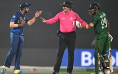 Flashpoint: Sri Lanka's Sadeera Samarawickrama (left) and Bangladesh's Najmul Hossain Shanto have to be separated by the umpire in Monday's tense clash