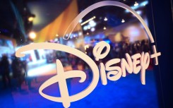 Fans are reflected in Disney+ logo during the Walt Disney D23 Expo in Anaheim, California in September 2022