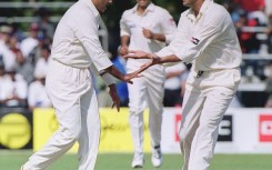 Sultans of swing: Pakistan fast bowler Waqar Younis (left) celebrates with Wasim Akram at a match in Toronto in 1999