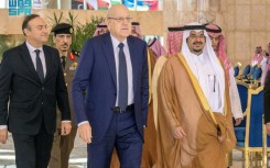 Riyadh deputy governor, Prince Mohammed bin Abdulrahman bin Aabdulaziz, (R) receiving Lebanese premier Najib Mikati ahead of the emergency summit