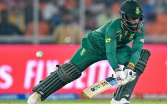 In pain: South Africa's captain Temba Bavuma plays a shot on Friday 