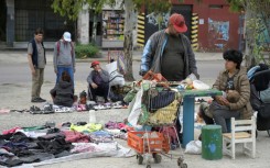 In and around the bustling Argentine capital, it is an increasingly common sight for people to knock on doors asking for second-hand clothes to wear, barter or sell