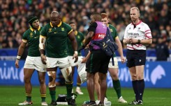 South Africa hooker Bongi Mbonambi (2L) goes off injured in the 2023 Rugby World Cup final against New Zealand in Paris 