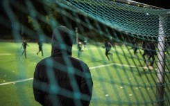 Fear: a parent oversees children training at Rinkeby United football club near Stockholm