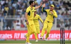 First strike: Australia's Mitchell Starc celebrates after taking the wicket of South Africa captain Temba Bavuma