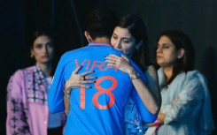 Bollywood actress Anushka Sharma hugs her husband, the Indian cricketer Virat Kohli