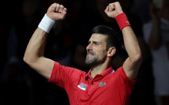 Serbia's Novak Djokovic celebrates beating Britain's Cameron Norrie to send his country into the semi-finals on Thursday