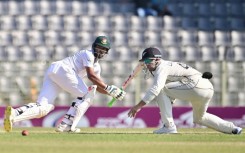 Bangladesh’s Najmul Hossain Shanto (L) plays a shot 